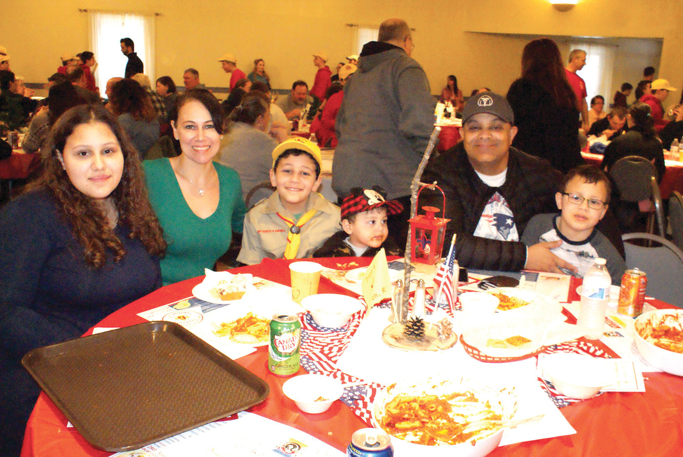 A FAMILY MATTER: Boy Scout Nicholas Espinal of Troop 6 Cranston took time from serving guests to pose with his family during Sunday’s dinner. Pictured are 15-year-old Emily, his mother, Cheryl, 10-year-old Nicholas, 2-year-old Evan, his father, Carlos, and 7-year-old Carson.